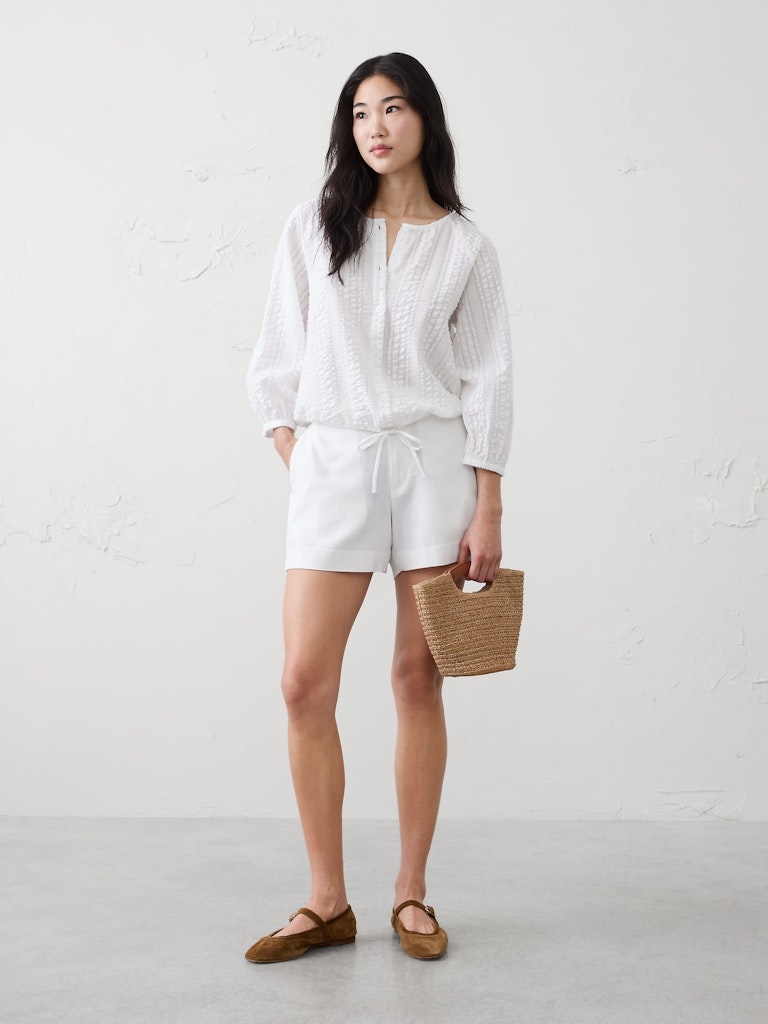 Blouson-Sleeve Buttoned Cloud Check Top: $40 Blouson-Sleeve Buttoned Cloud Check Top: $40