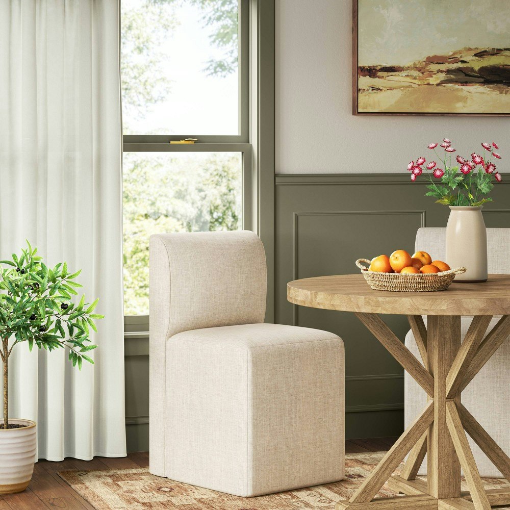 Amelia Upholstered Dining Chair: $350 Amelia Upholstered Dining Chair: $350