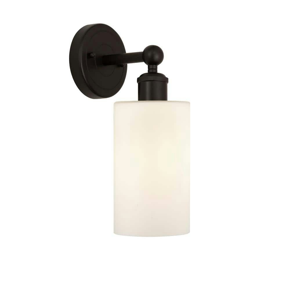 Clymer 1-Light Oil Rubbed Bronze and Matte White Wall Sconce: $74.60 Clymer 1-Light Oil Rubbed Bronze and Matte White Wall Sconce: $74.60