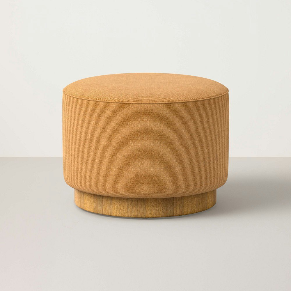 Hearth & Hand with Magnolia Round Ottoman with Plinth Base: $249.99 Hearth & Hand with Magnolia Round Ottoman with Plinth Base: $249.99
